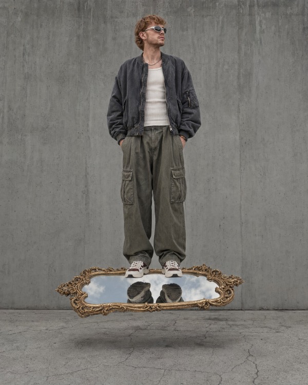 Surreal documentary photography of a young man with reddish-blond hair
